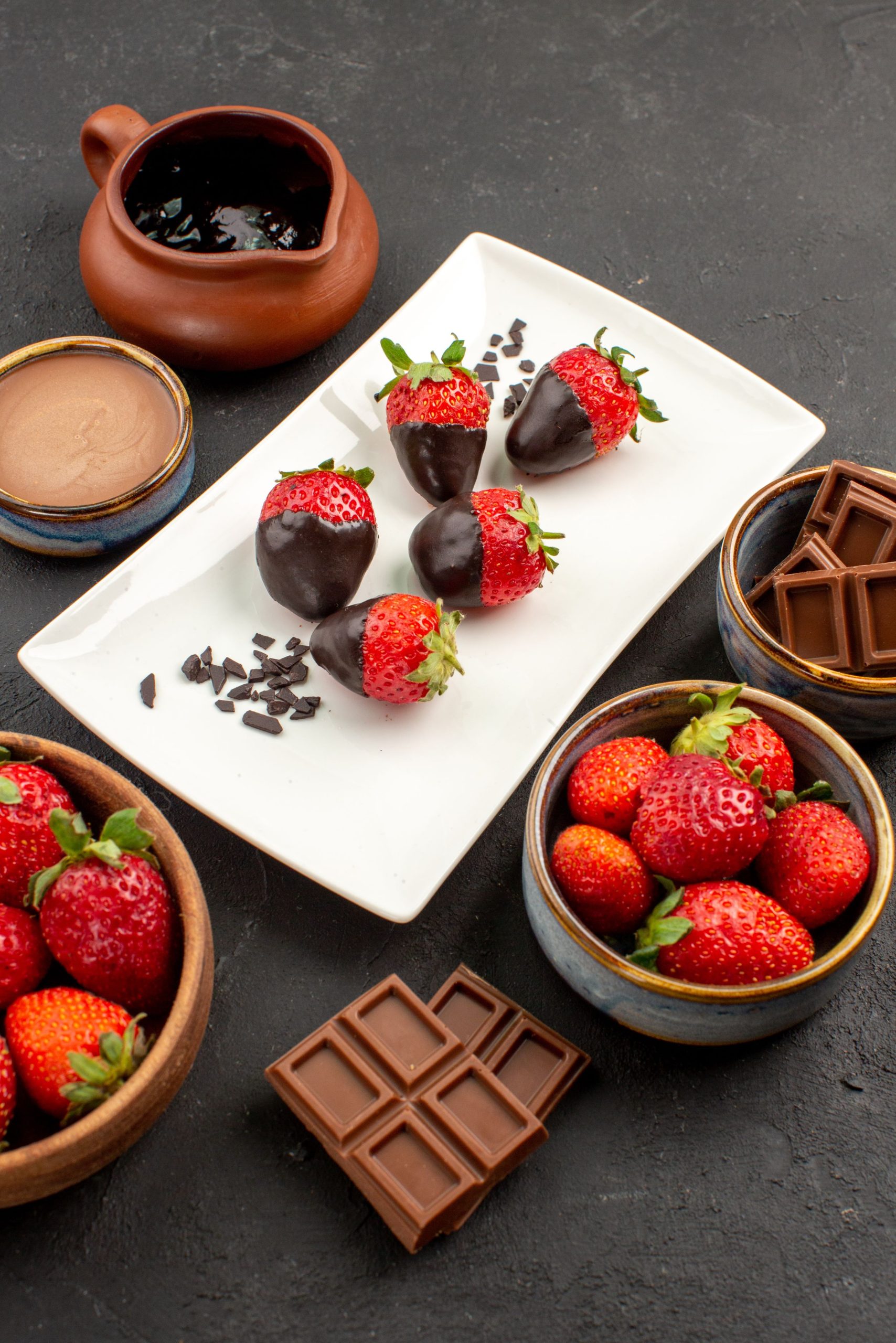 Chocolate covered strawberries on a plate.