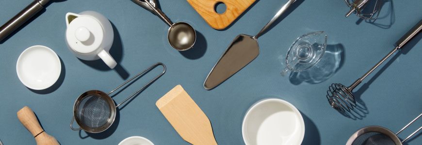 Kitchen accessories laid out on a blue counter