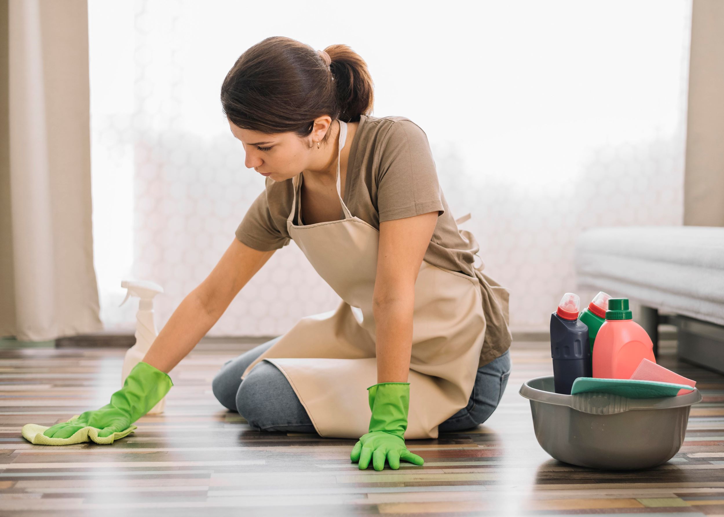 Woman cleaning laminate floor